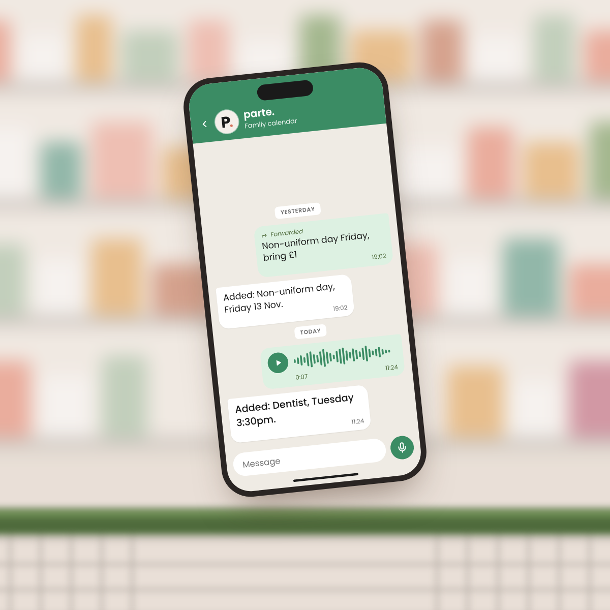 A phone in the supermarket showing the parte. chat on WhatsApp: a seven-second voice note, and parte.'s reply, Added: Dentist, Tuesday 3:30pm